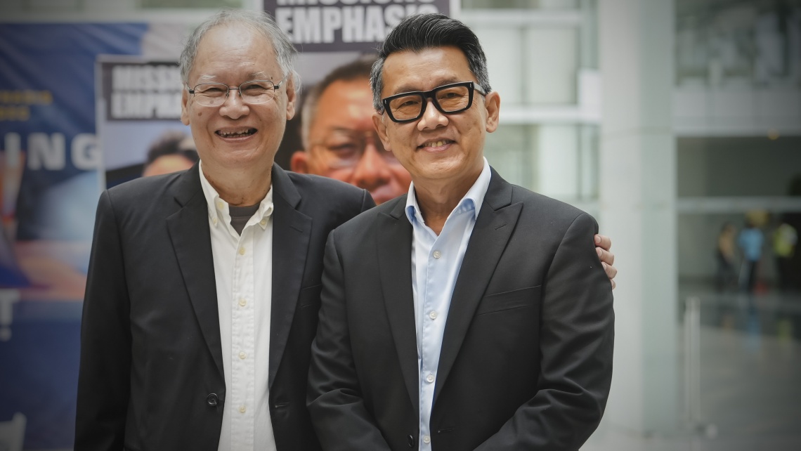 A warm moment shared between Pastor Steven Kum and Rev. Meechai Kowae.
